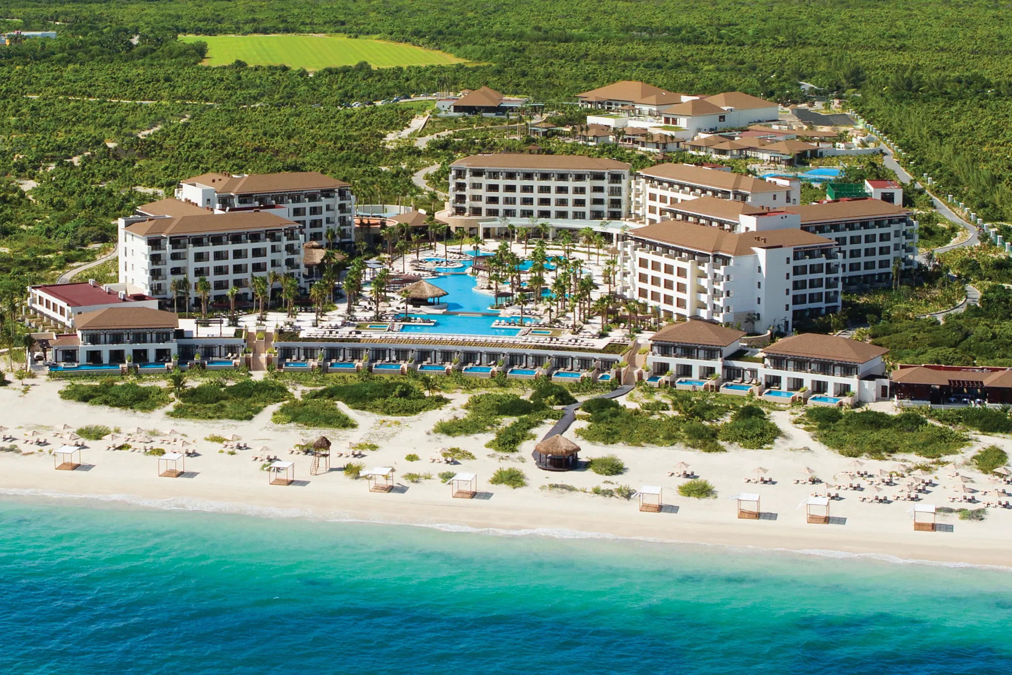 Aerial view of Secrets Playa Mujeres Golf & Spa Resort beachfront property in Cancun, Mexico.