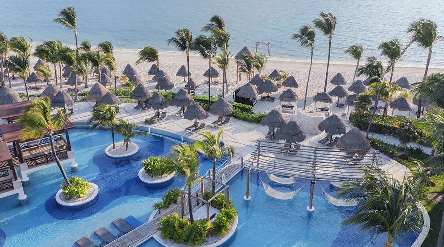 Excellence Playa Mujeres adults-only all-inclusive resort with luxury suites, pristine beach, and elevated dining near Cancun, Mexico.