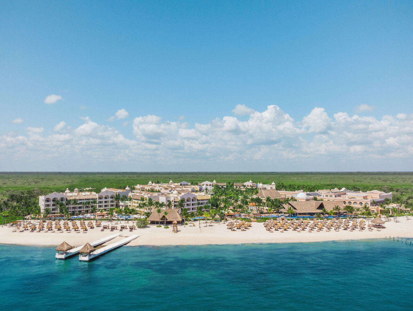 Excellence Riviera Cancun adults-only all-inclusive resort with beachfront pools, swim-up suites, and luxury amenities on the Riviera Maya.