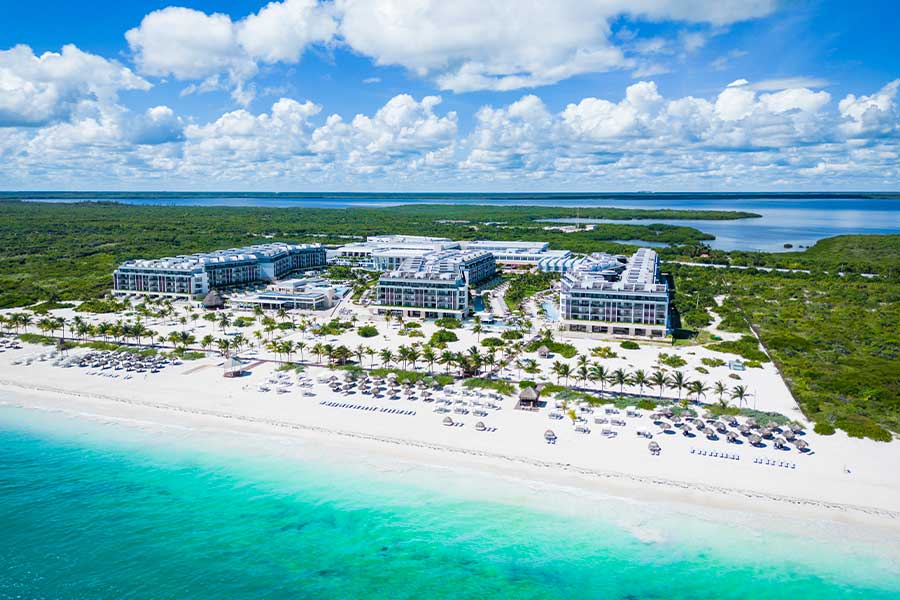 Majestic Elegance Costa Mujeres luxury all-inclusive resort with expansive pools, beachfront location, and family-friendly amenities near Cancun.