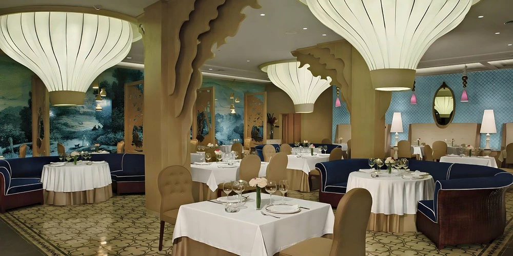 Bordeaux Restaurant elegant indoor dining venue for wedding receptions at Secrets Playa Mujeres