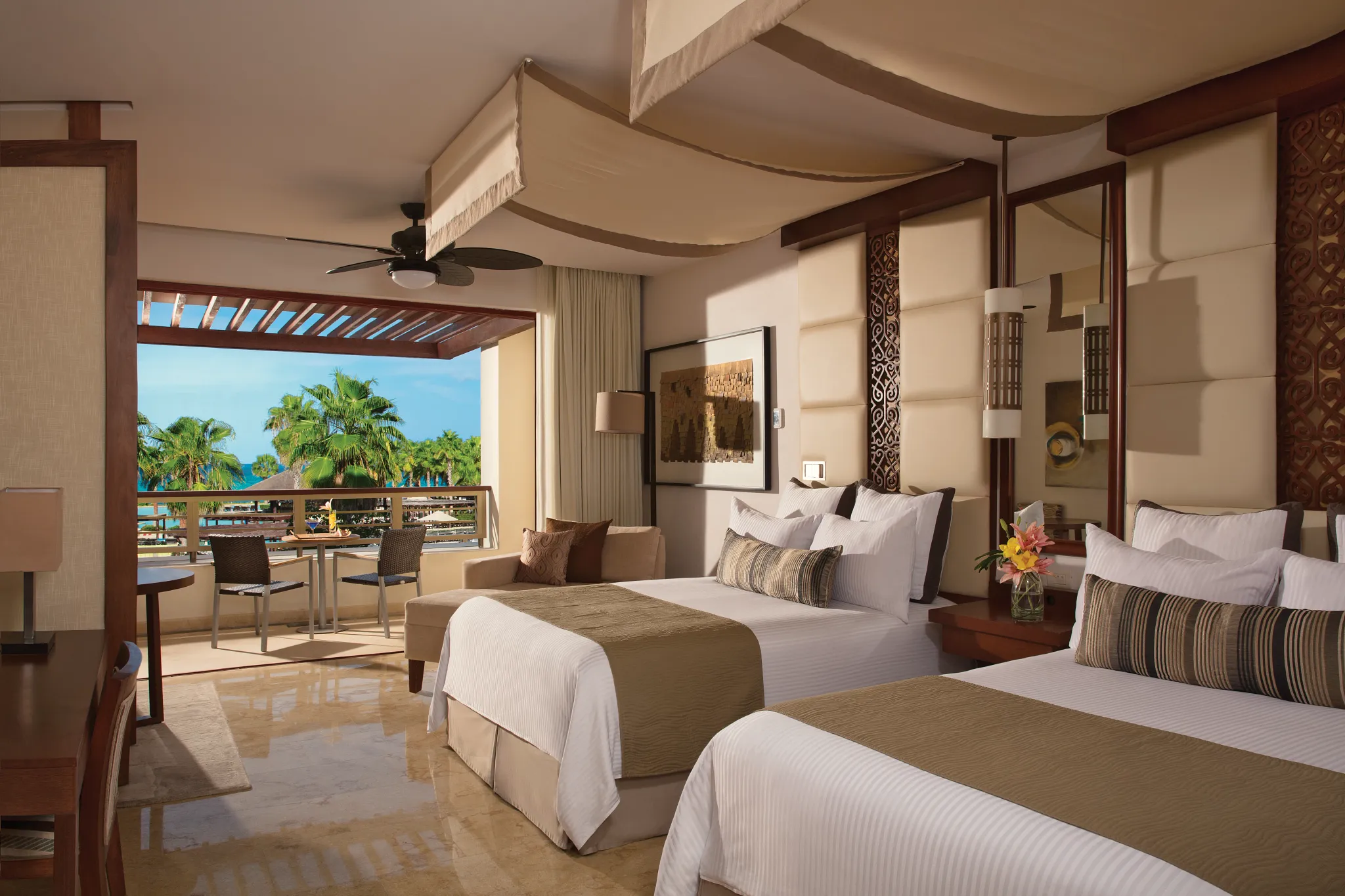 Junior Suite Ocean View two double beds with balcony at Secrets Playa Mujeres Golf & Spa Resort.