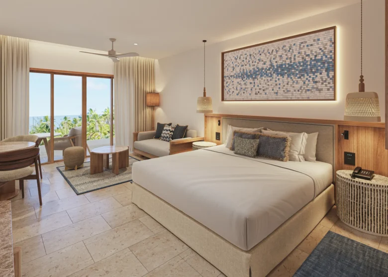 Junior Suite Swim Out king bed with modern décor and private terrace at Secrets Playa Mujeres Golf & Spa Resort.