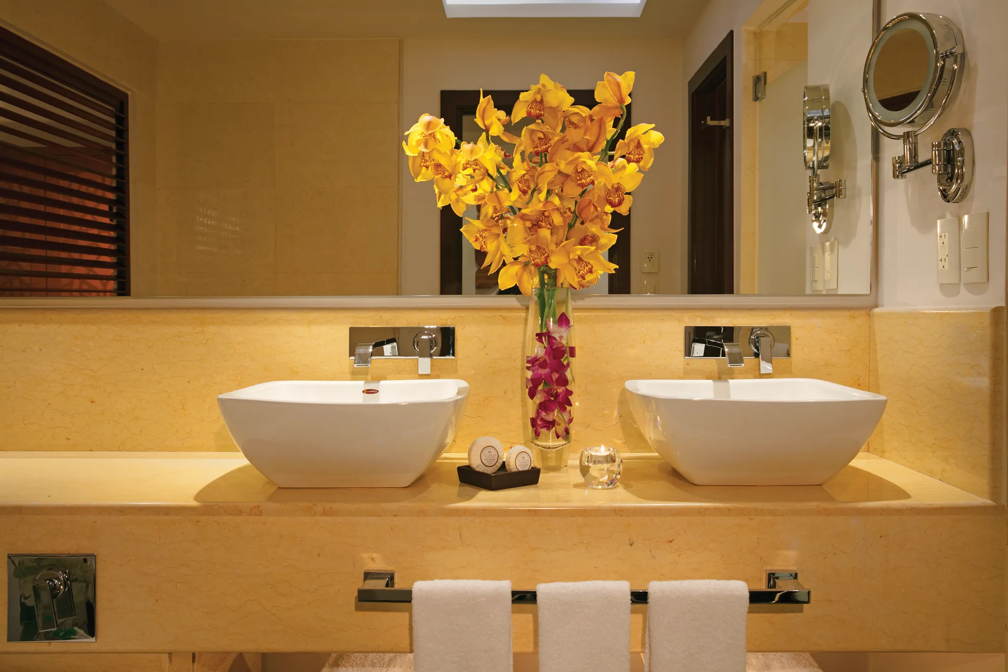 Preferred Club Junior Suite Ocean View double vanity bathroom at Secrets Playa Mujeres Golf & Spa Resort.