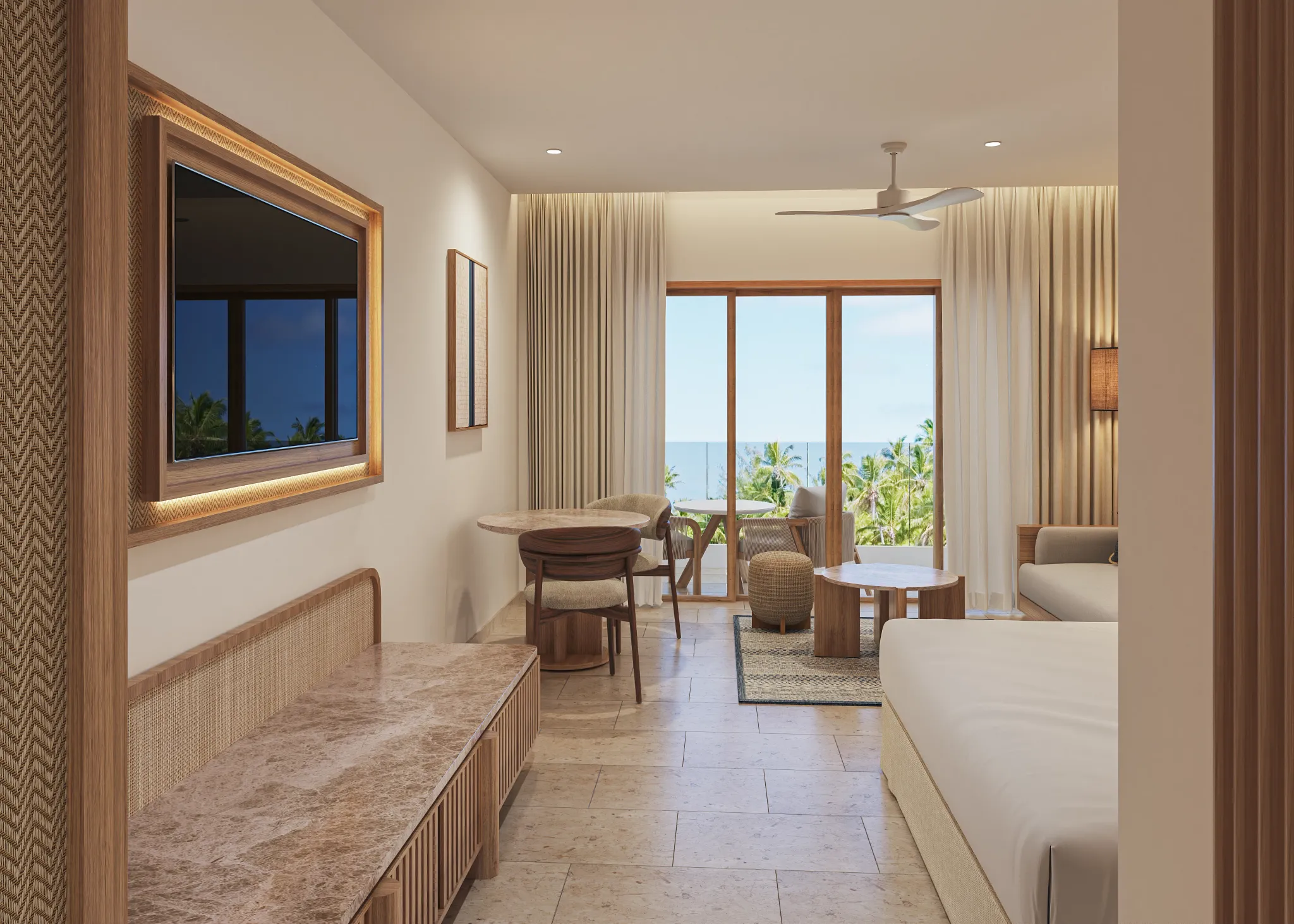 Preferred Club Junior Suite Ocean View Swim Out king bedroom with canopy bed and seating area at Secrets Playa Mujeres Golf & Spa Resort.