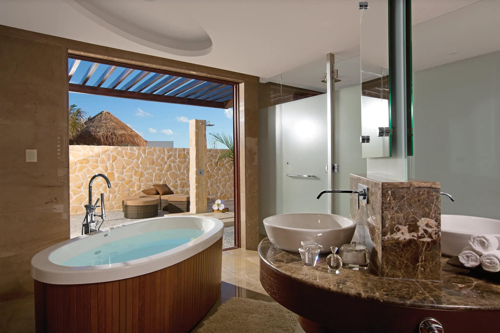 Presidential Suite bathroom with soaking tub and outdoor terrace access at Secrets Playa Mujeres Golf & Spa Resort.