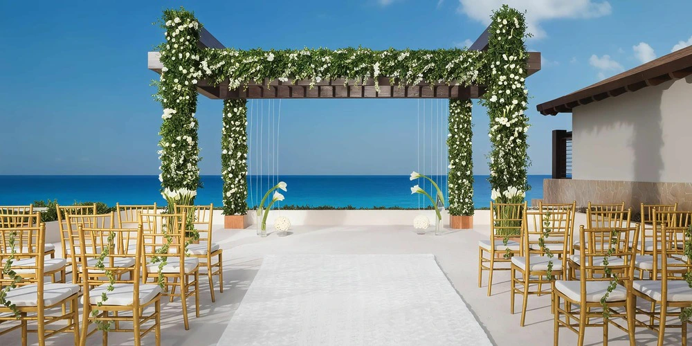 Oceanfront wedding gazebo ceremony setup at Secrets Playa Mujeres Golf & Spa Resort