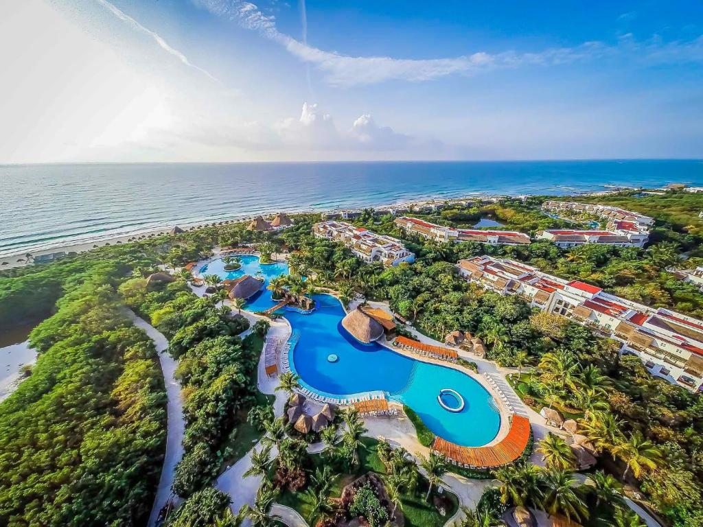 Valentin Imperial Riviera Maya adults-only all-inclusive resort with colonial architecture, beachfront pools, and lush jungle setting near Playa del Carmen.